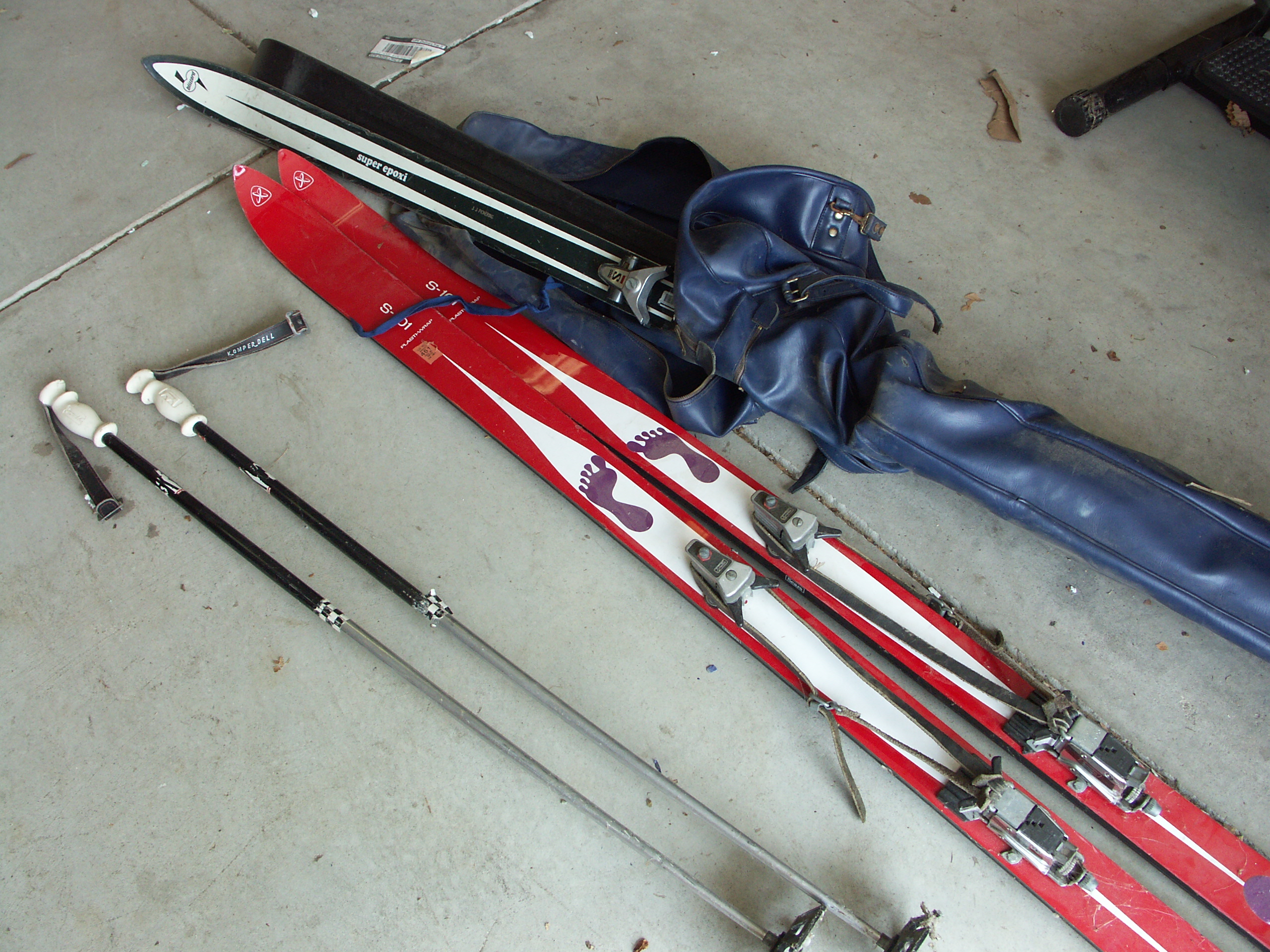 Lot of Vintage Skis and Pair of Ski Poles