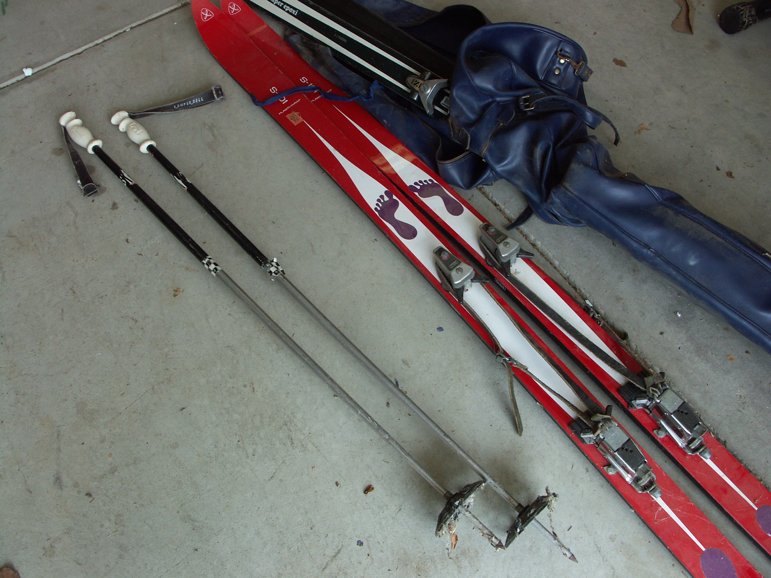 Lot of Vintage Skis and Pair of Ski Poles