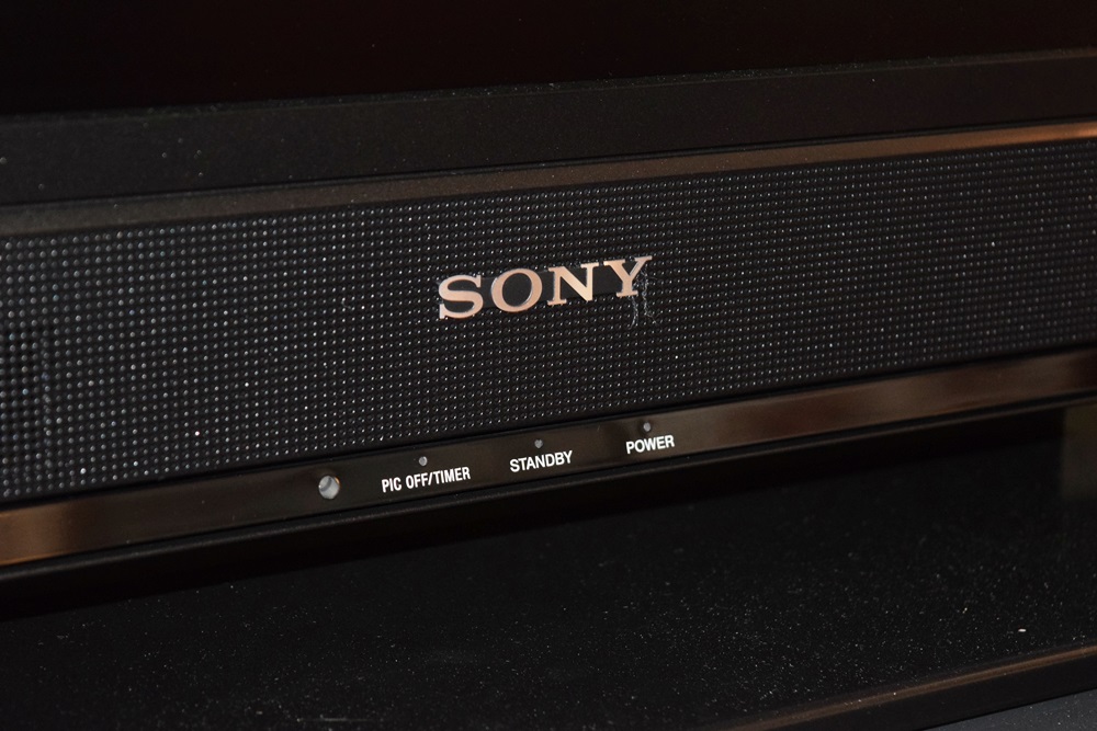 A Sony Bravia 32" Class Digital TV, Stand and Yamaha DVD Player