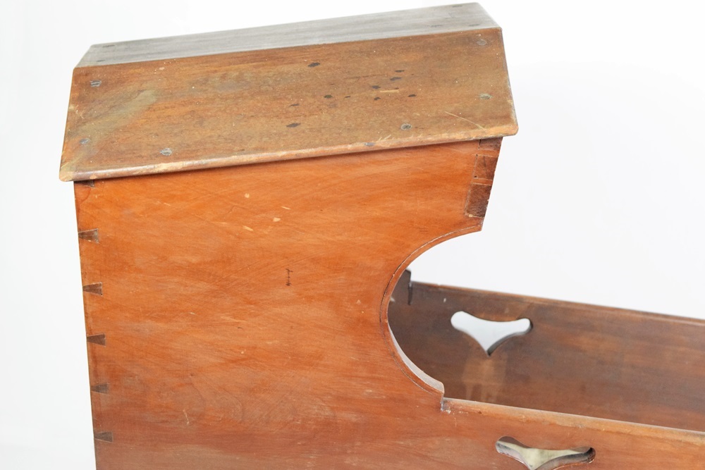 A Charming Antique Baby Cradle with Heart Cutouts