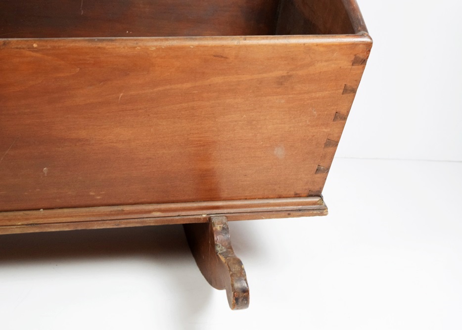 A Charming Antique Baby Cradle with Heart Cutouts