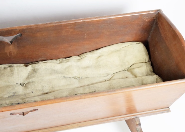 A Charming Antique Baby Cradle with Heart Cutouts