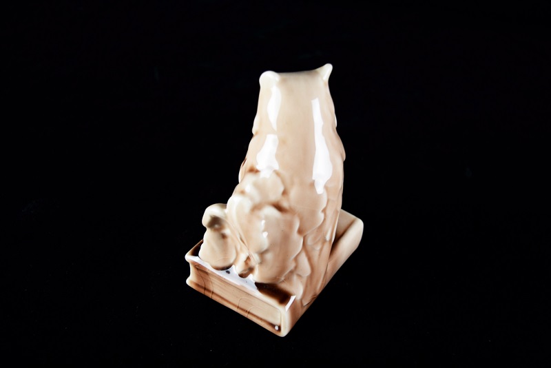 A Rookwood "Owl" Bookend or Paperweight in Soft Brown Gloss Glaze