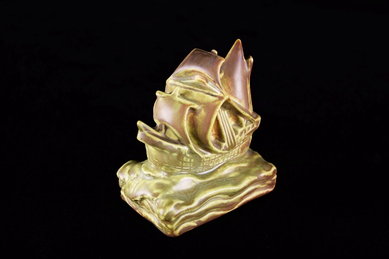 A Rookwood Ship Paperweight and Round Valet Tray with Ship Image