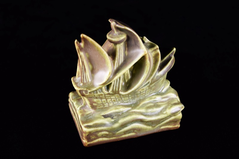 A Rookwood Ship Paperweight and Round Valet Tray with Ship Image