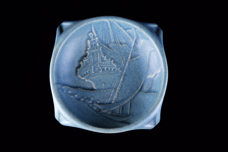 A Rookwood Ship Paperweight and Round Valet Tray with Ship Image