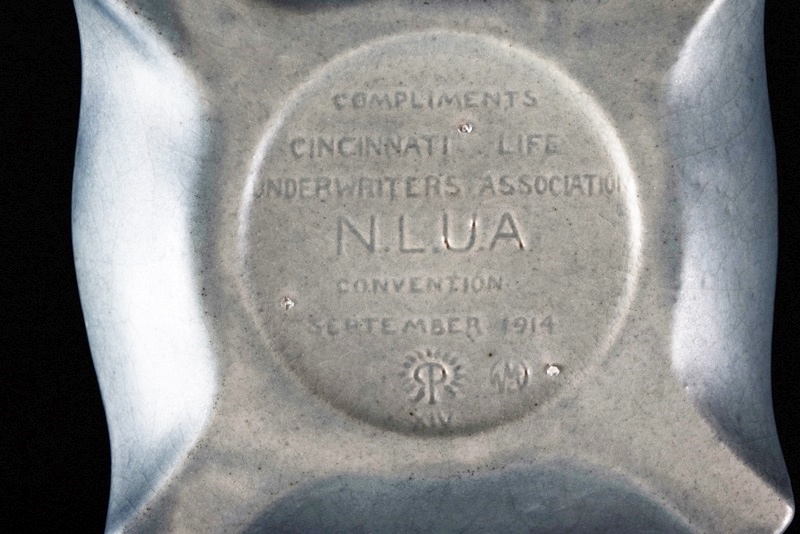 A Rookwood Ship Paperweight and Round Valet Tray with Ship Image