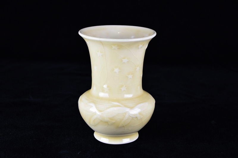 A Rookwood Vase Embossed with Geese & Stars in Pale Yellow Glaze