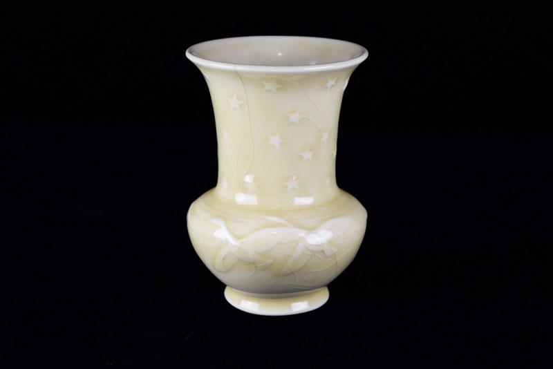 A Rookwood Vase Embossed with Geese & Stars in Pale Yellow Glaze