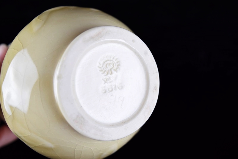 A Rookwood Vase Embossed with Geese & Stars in Pale Yellow Glaze