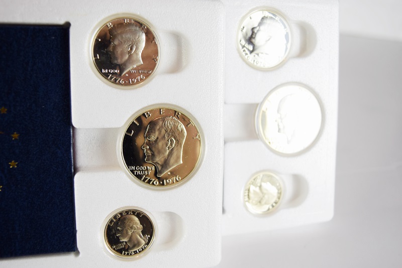 An Uncirculated U.S. Coin Collection and Various Stamps