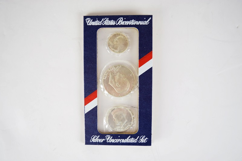 An Uncirculated U.S. Coin Collection and Various Stamps