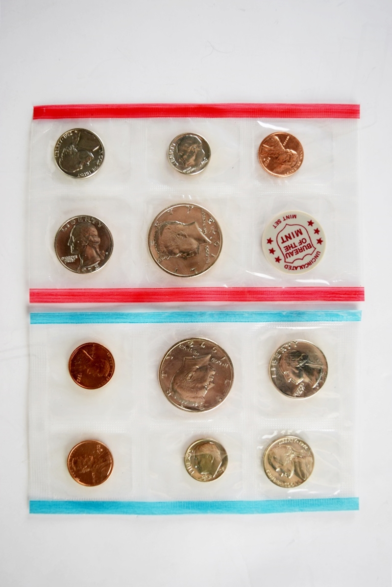 An Uncirculated U.S. Coin Collection and Various Stamps