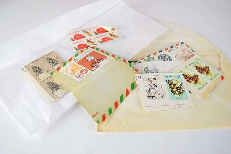 An Uncirculated U.S. Coin Collection and Various Stamps