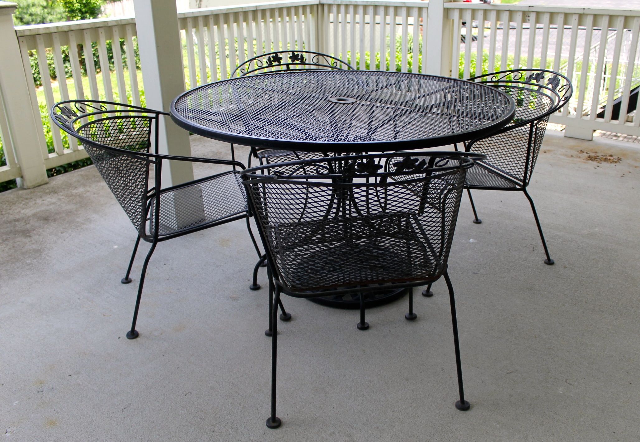 Wrought Iron Patio Table, Four Chairs and Umbrella Stand
