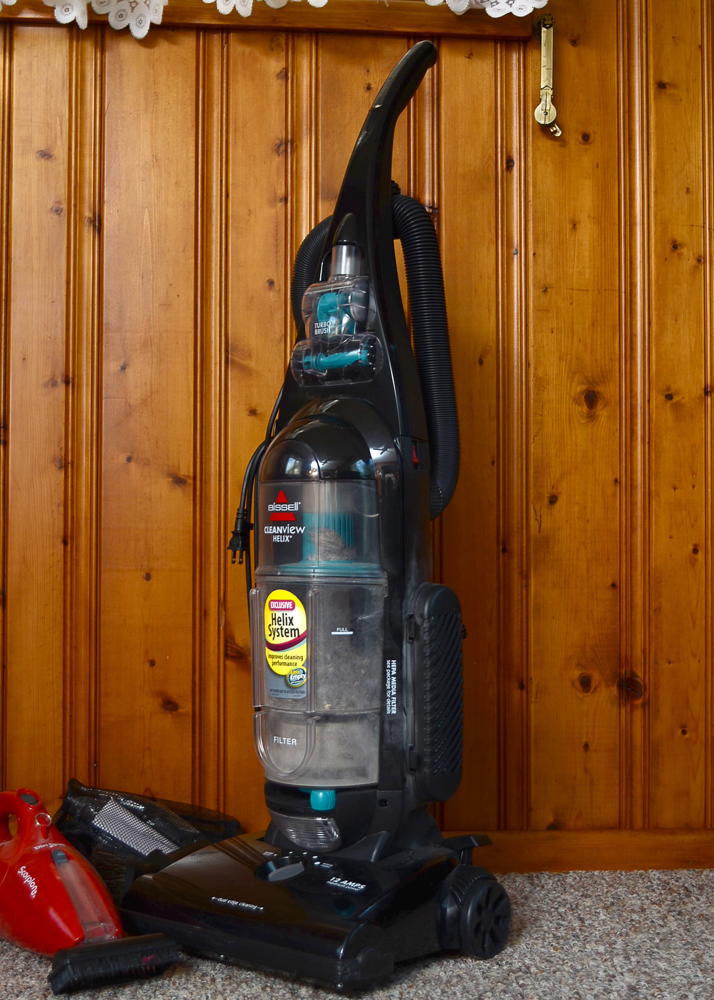 Bissell Vacuum Cleaner and a Handheld Dirt Devil 