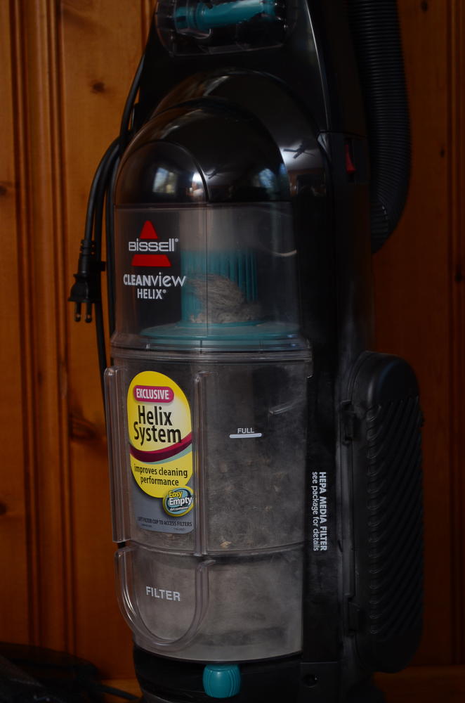 Bissell Vacuum Cleaner and a Handheld Dirt Devil 