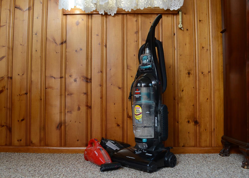 Bissell Vacuum Cleaner and a Handheld Dirt Devil 
