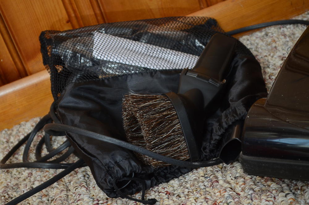 Bissell Vacuum Cleaner and a Handheld Dirt Devil 