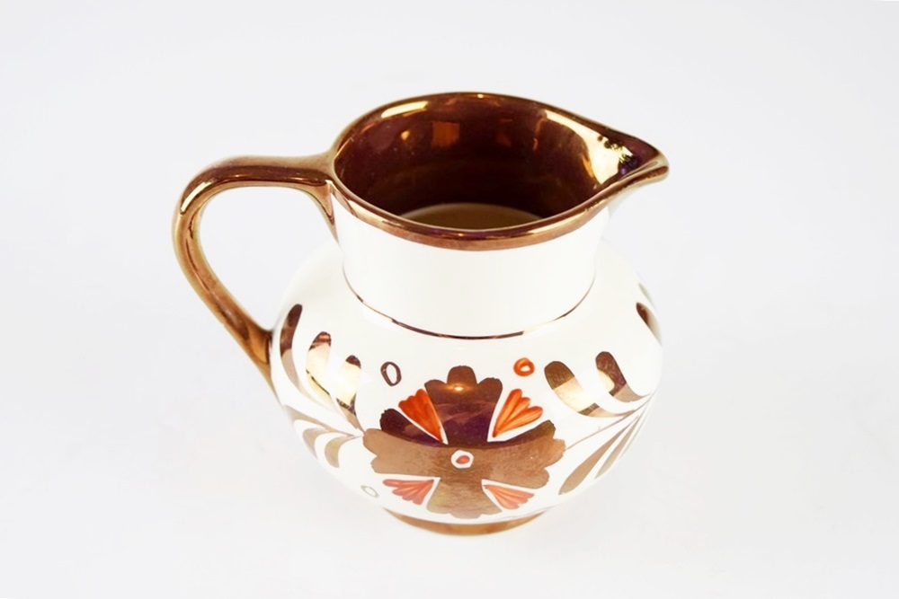 A Petite Antique Copper Lustre "Old Castle" Creamer