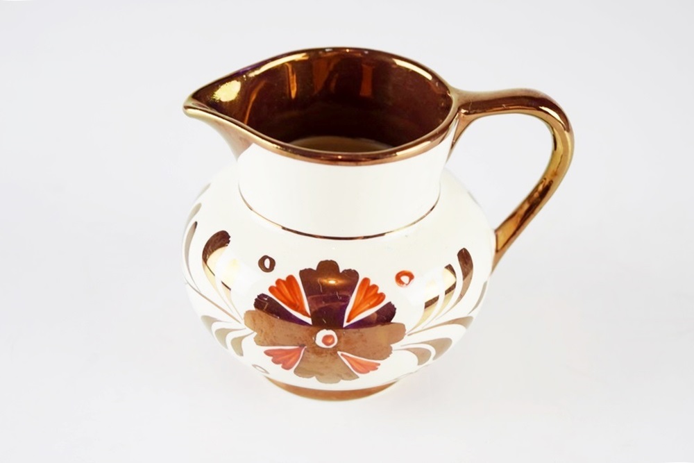 A Petite Antique Copper Lustre "Old Castle" Creamer