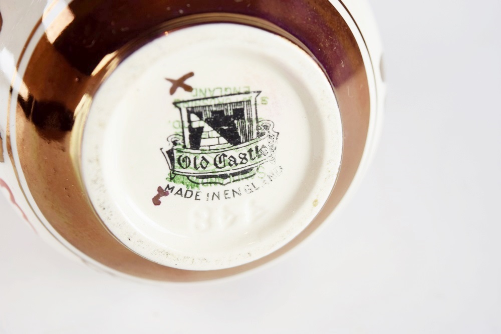 A Petite Antique Copper Lustre "Old Castle" Creamer