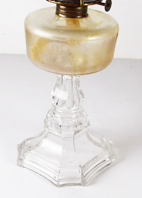 Four Antique Oil Lamps in a Variety of Sizes