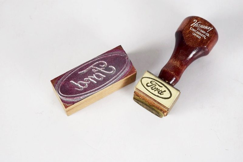 Two Boxes Filled with Ford Novelties