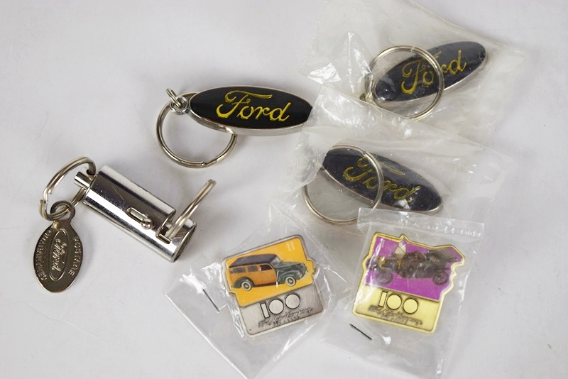 Two Boxes Filled with Ford Novelties