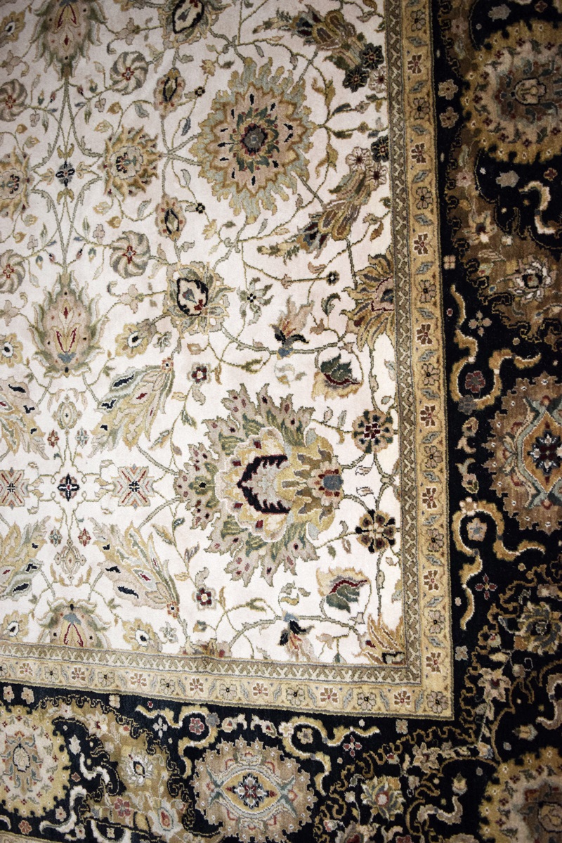 An Attractive All Wool Room Size Rug in Ivory with Black Borders