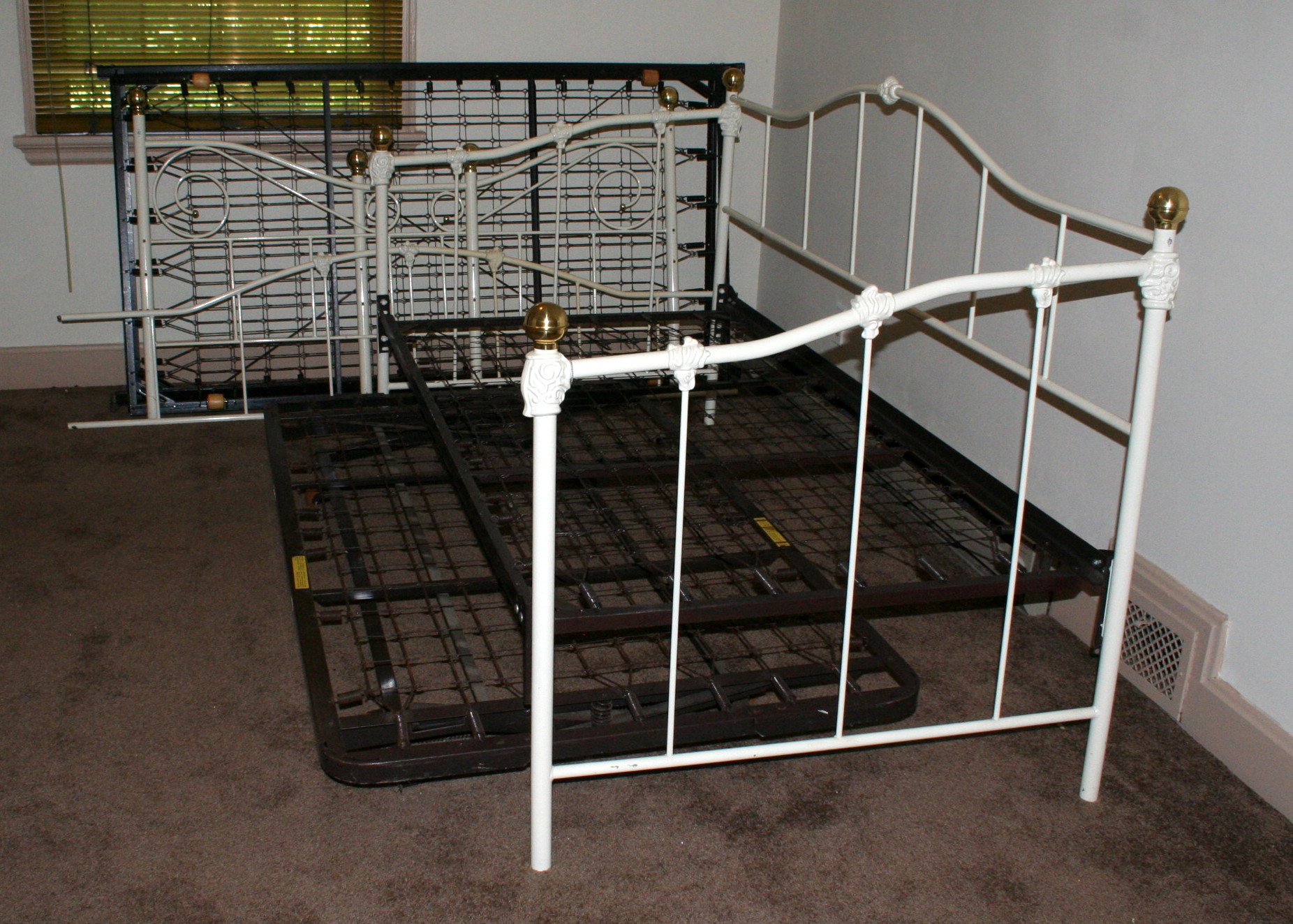 Two Iron Trundle Beds