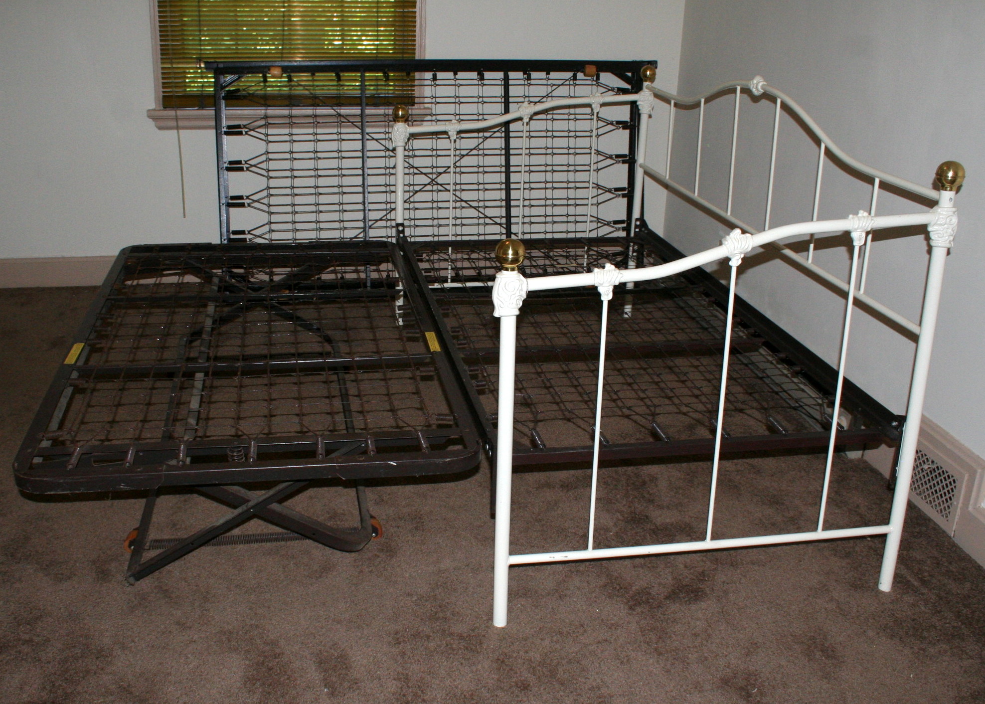 Two Iron Trundle Beds