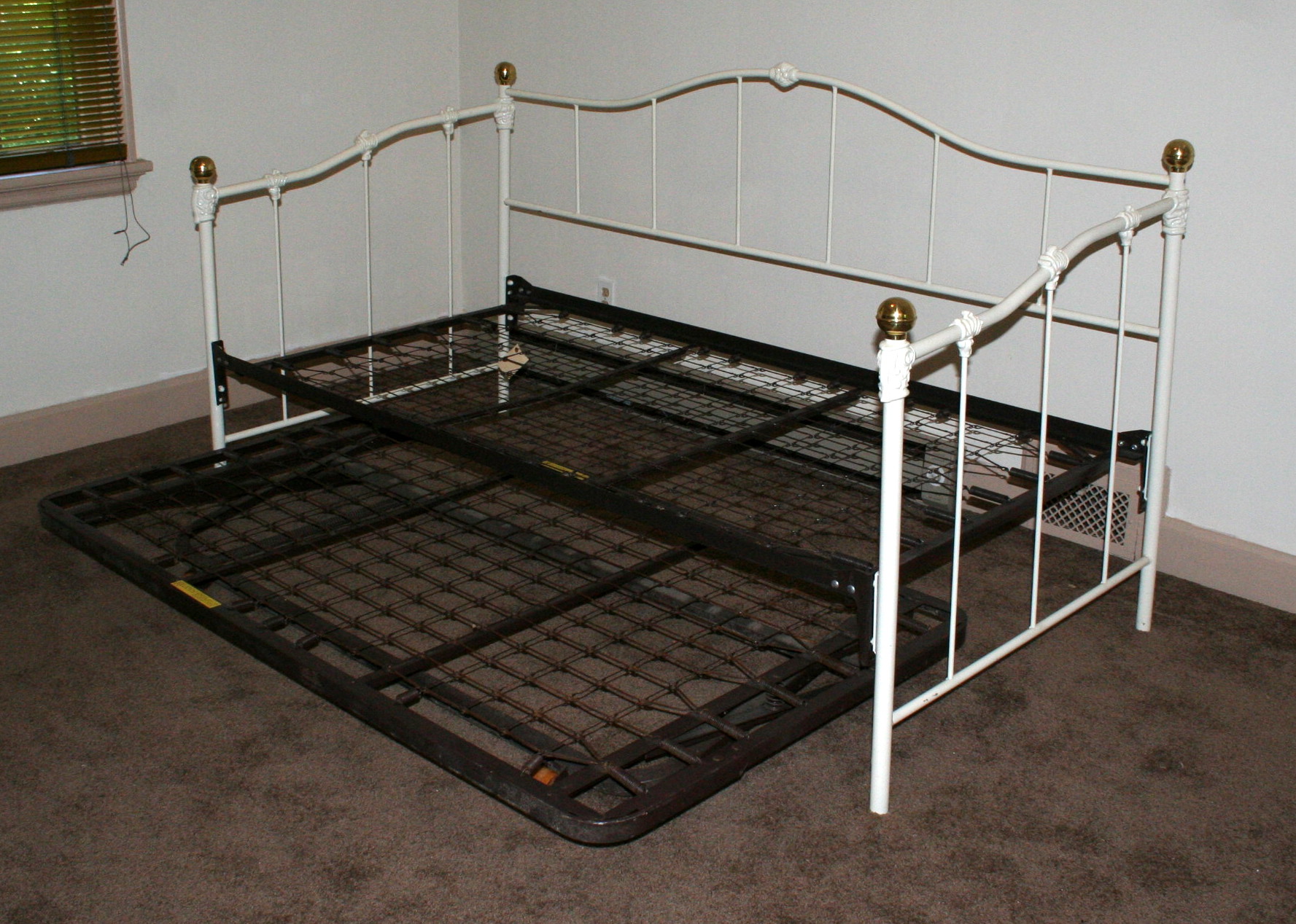 Two Iron Trundle Beds