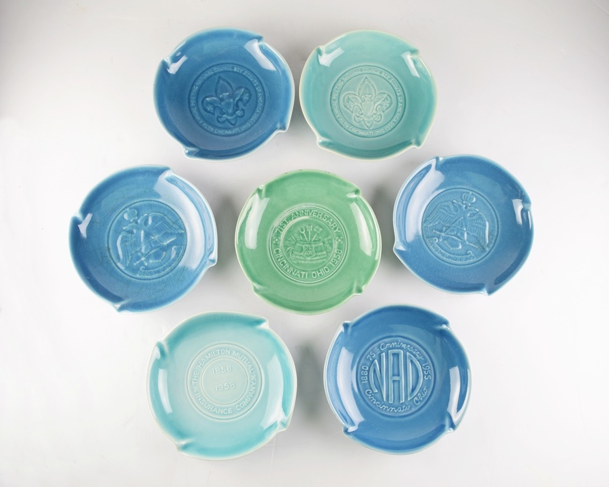 A Collection of Seven Rookwood Advertising Ash Receivers