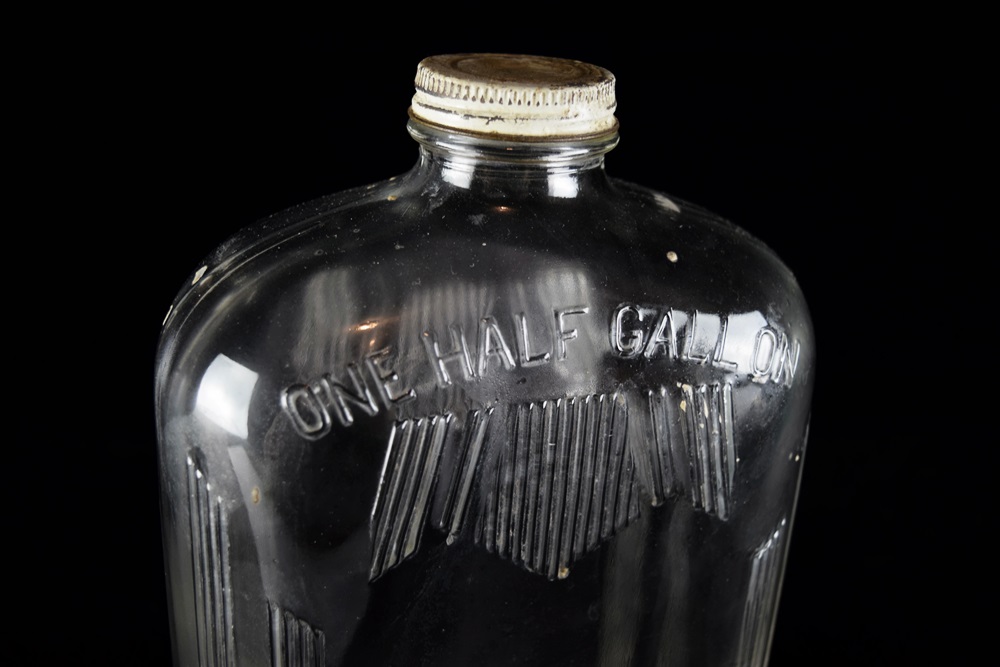 A Pair of Vintage Glass Half Gallon Milk Jugs