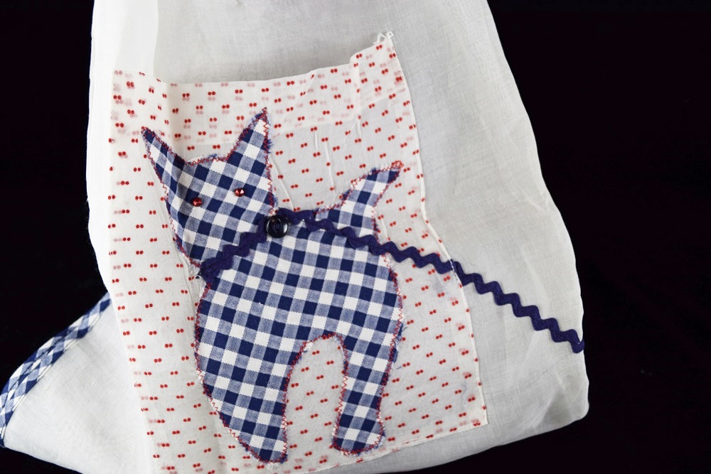 Eleven Vintage Aprons in a Variety of Prints