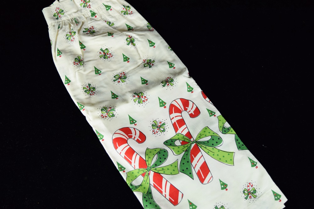 Eleven Vintage Aprons in a Variety of Prints