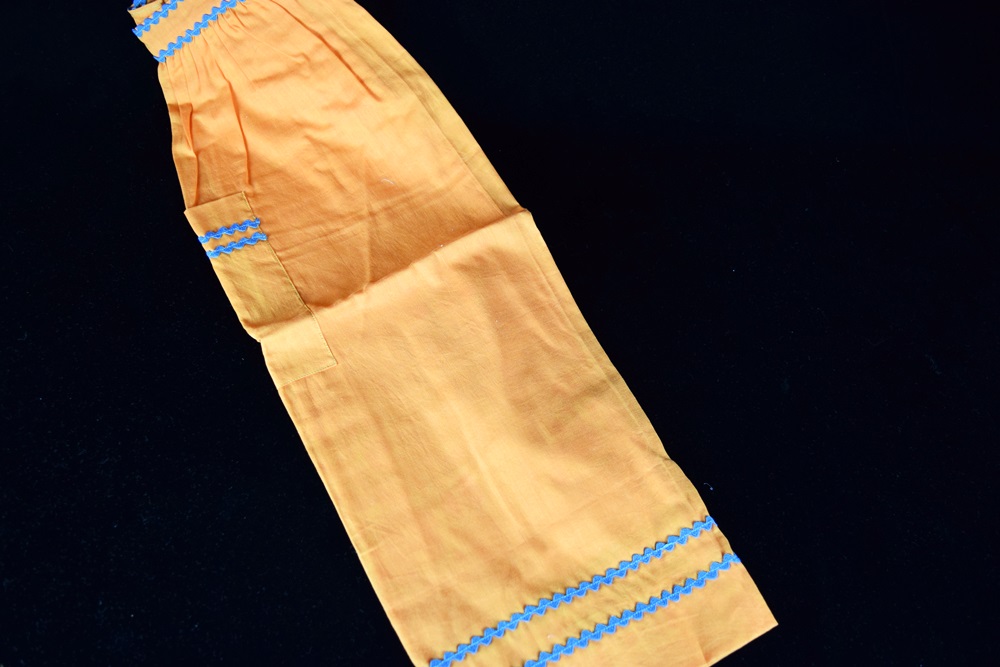 Eleven Vintage Aprons in a Variety of Prints