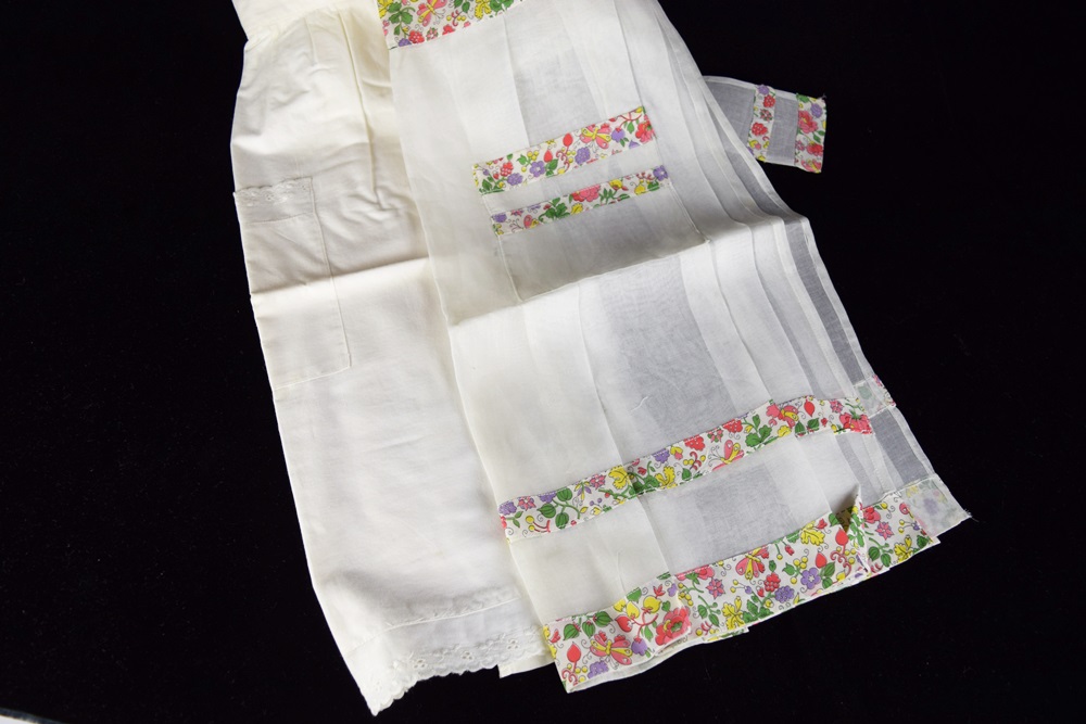 Eleven Vintage Aprons in a Variety of Prints