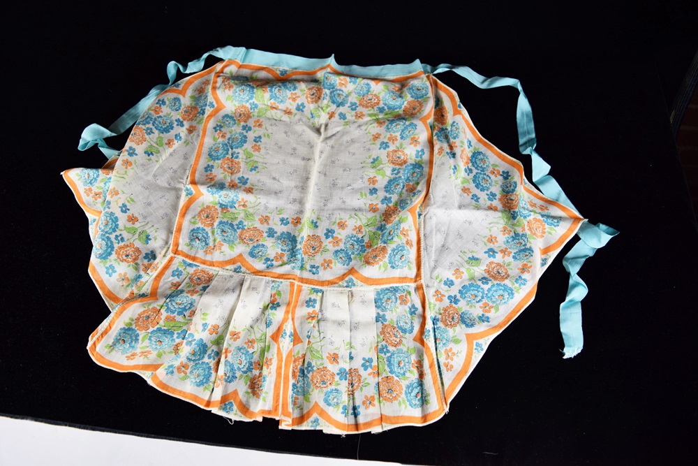Eleven Vintage Aprons in a Variety of Prints