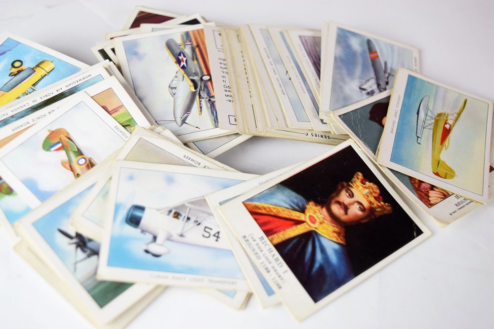 A Large Tin Filled with Vintage Match Books and Cigarette Cards