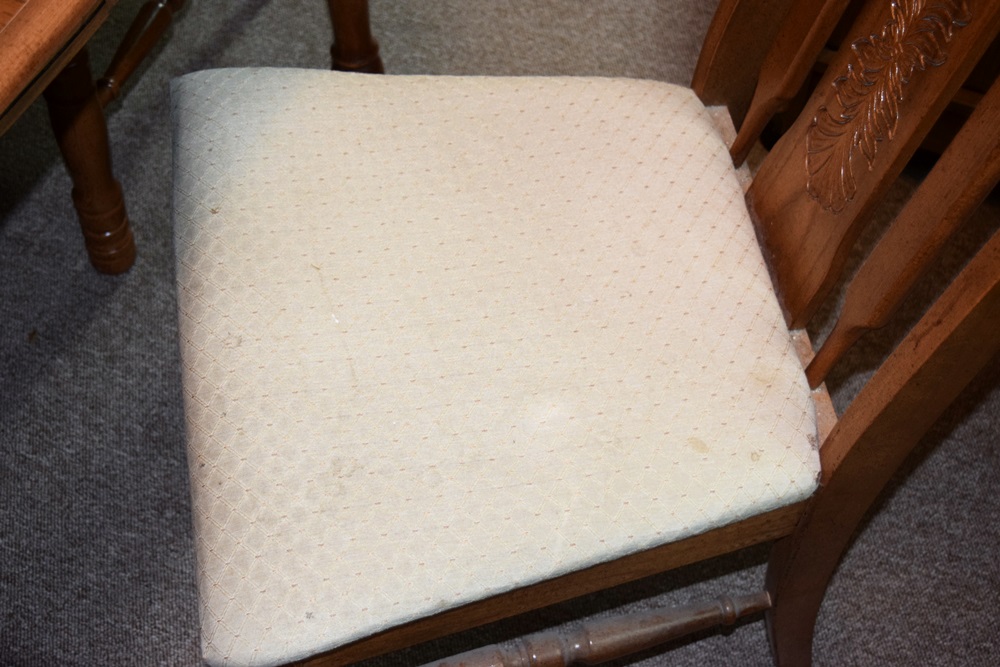 An Expandable Kitchen Table and Four Oak Chairs 