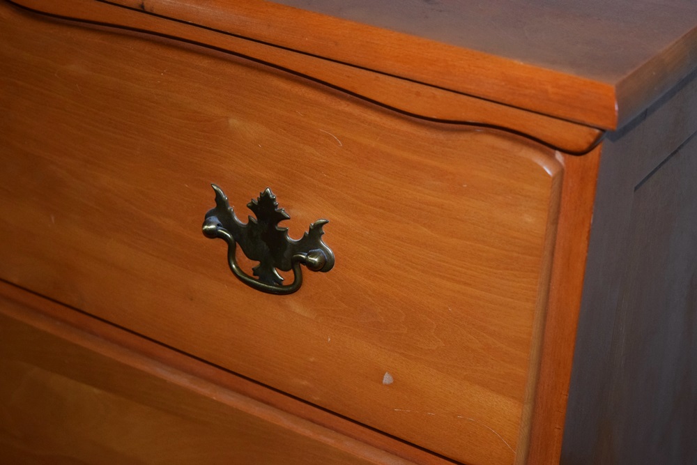 A Traditionally Styled Pine Chest of Drawers and Bedside Table