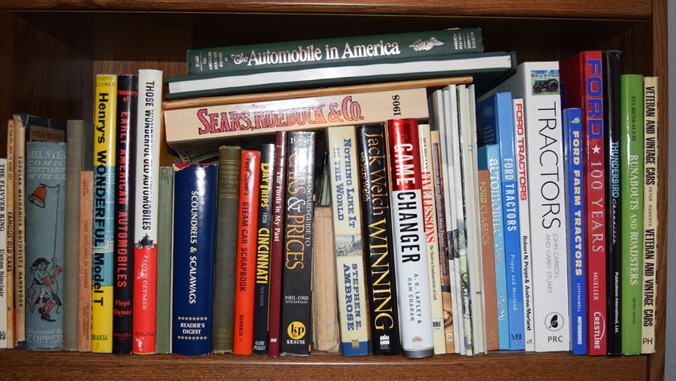 A Bookcase Filled with Books Referring to Cars and Trucks