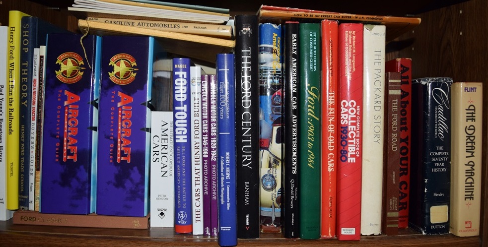 A Bookcase Filled with Books Referring to Cars and Trucks