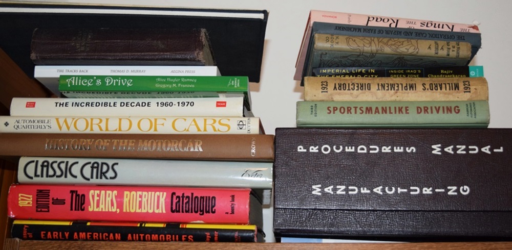 A Bookcase Filled with Books Referring to Cars and Trucks