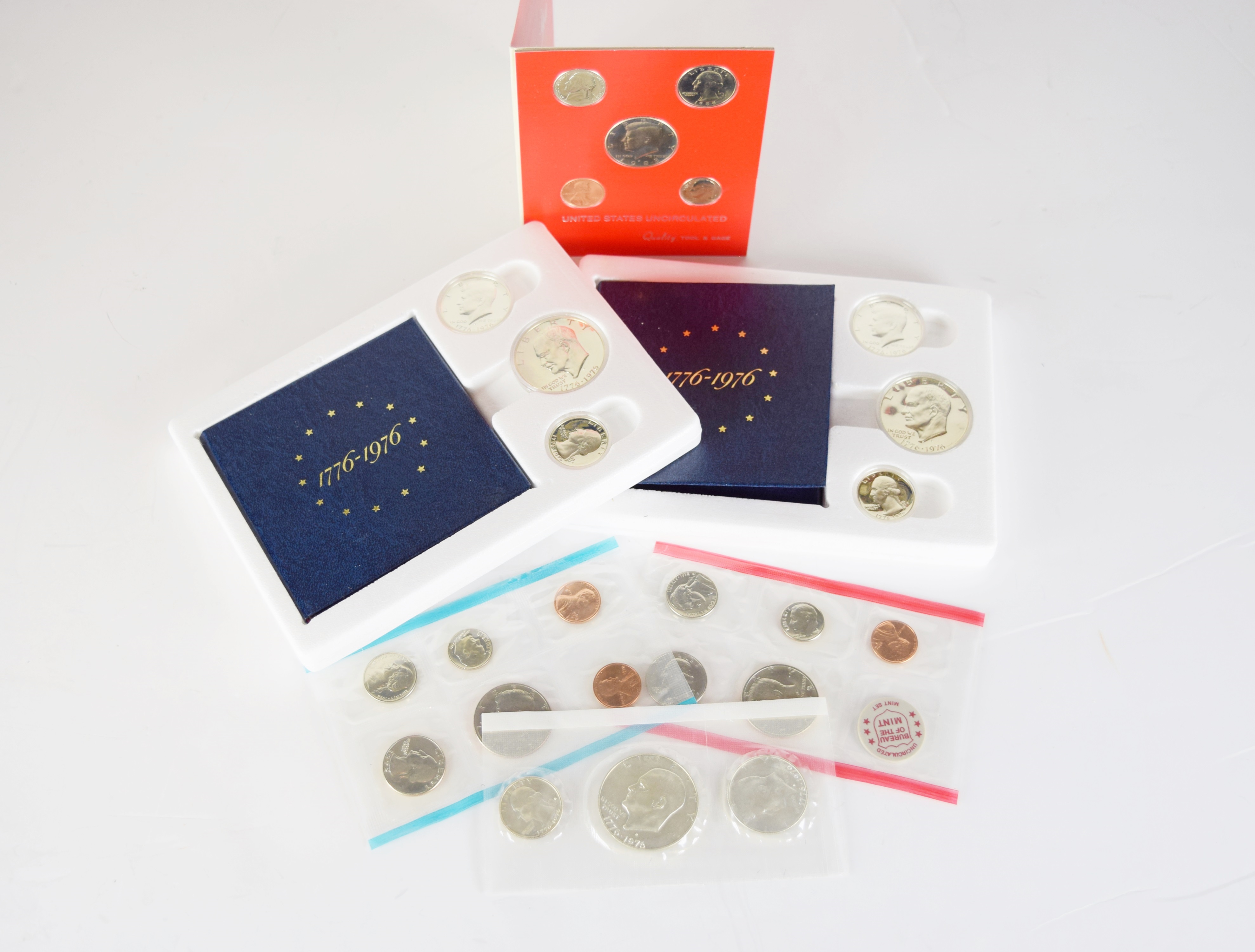 An Uncirculated U.S. Coin Collection and Various Stamps