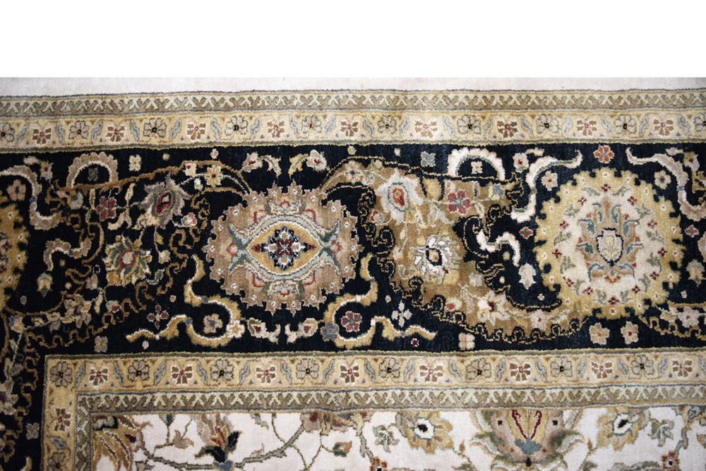 An Attractive All Wool Room Size Rug in Ivory with Black Borders