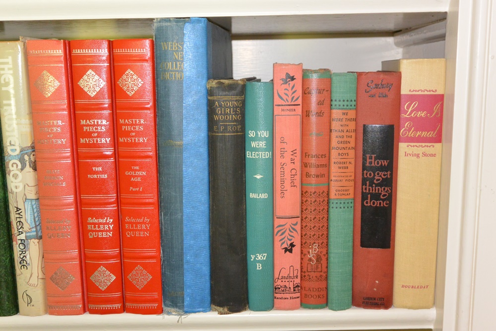 Three Shelves of Books Mostly Older Educational and Novels