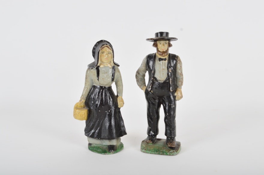 Vintage Cast Iron Door Stops Depicting an Amish Couple